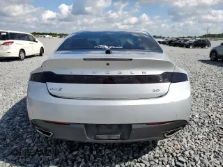 2013 Lincoln MKZ z VIN 3LN6L2G94DR820729, wystawiony jako Copart lot #53243145 z przebiegiem 111 753 mil mil oraz Szkoda całkowita • Salvage title. Historia ofert i sprzedaży dostępna na DreamBid. Obrazek 6.