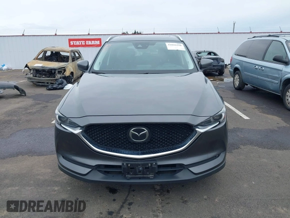 2020 Mazda CX-5 Grand Touring with VIN JM3KFBDM4L0829861, listed as a IAAI auction lot 41826250 with 62,091 mi miles and . Bid and sale history available at carsss.com. Image 13.