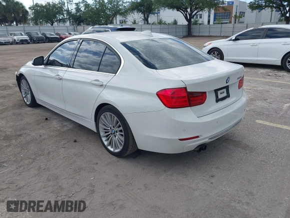 2012 BMW 3 Series 328i with VIN WBA3A5C57CF347953, listed as a IAAI auction lot 42176008 with 140,598 mi miles and . Bid and sale history available at carsss.com. Image 3.