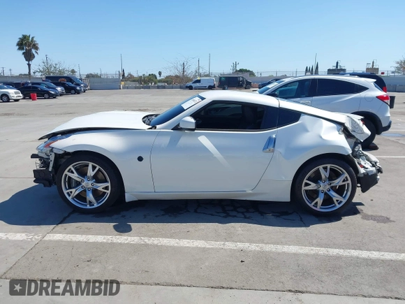 2009 Nissan 370Z Touring with VIN JN1AZ44E99M411252, listed as a IAAI auction lot 41969671 with 91,873 mi miles and . Bid and sale history available at DreamBid. Image 14.