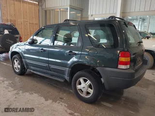 2003 Ford Escape XLS Popular with VIN 1FMYU02143KC35891, listed as a IAAI auction lot 41599760 with 148,381 mi miles. Bid and sale history available at carsss.com. Image 3.