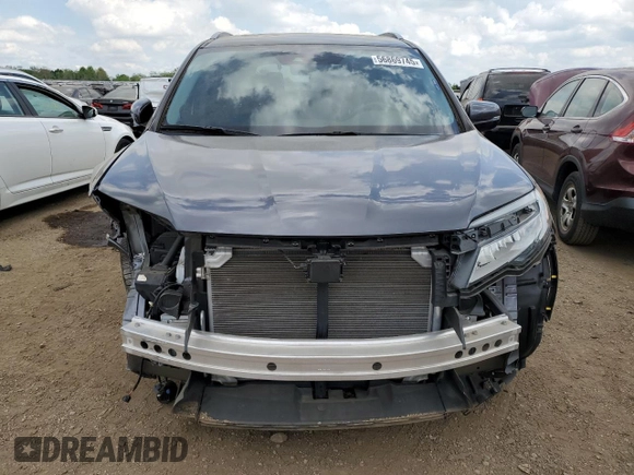 2022 Honda Pilot Touring 7-Passenger with VIN 5FNYF6H6XNB014347, listed as a Copart auction lot 56869745 with 31,513 mi miles and Salvage title. Bid and sale history available at DreamBid. Image 5.
