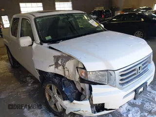 2014 Honda Ridgeline RTL with VIN 5FPYK1F55EB012490, listed as a IAAI auction lot 41391884 with 130,121 mi miles. Bid and sale history available at carsss.com. Image 1.