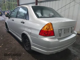 2003 Suzuki Aerio S z VIN JS2RA41S335159927, wystawiony jako IAAI lot #42012847 z przebiegiem 132 482 mil mil oraz . Historia ofert i sprzedaży dostępna na DreamBid. Obrazek 3.