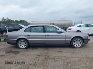 1998 BMW 7 Series 740il with VIN WBAGJ8323WDM23239, listed as a IAAI auction lot 41512630 with 221,673 mi miles. Bid and sale history available at carsss.com. Image 14.