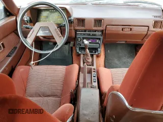 1983 Toyota Supra z VIN JT2MA67L9D0056034, wystawiony jako Copart lot #82382484 z przebiegiem 39 338 mil mil oraz Szkoda całkowita • Salvage title. Historia ofert i sprzedaży dostępna na DreamBid. Obrazek 8.