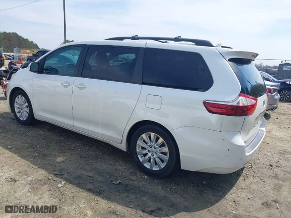 2015 Toyota Sienna XLE with VIN 5TDYK3DC0FS570007, listed as a IAAI auction lot 41794333 with 217,512 mi miles. Bid and sale history available at carsss.com. Image 3.