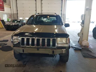 1996 Jeep Grand Cherokee Laredo with VIN 1J4GZ58S9TC293787, listed as a IAAI auction lot 41179368 with 141,755 mi miles. Bid and sale history available at carsss.com. Image 13.