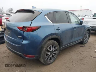 2017 Mazda CX-5 Grand Touring with VIN JM3KFADL9H0187338, listed as a IAAI auction lot 41382034 with 141,972 mi miles and . Bid and sale history available at carsss.com. Image 4.