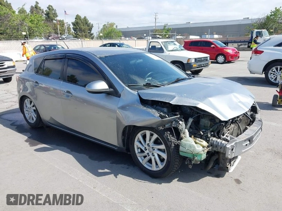 2012 Mazda Mazda3 i Touring with VIN JM1BL1L89C1558242, listed as a IAAI auction lot 42057513 with 112,094 mi miles. Bid and sale history available at carsss.com. Image 1.