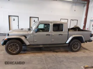 2021 Jeep Gladiator High Altitude with VIN 1C6HJTFG1ML556741, listed as a IAAI auction lot 42240680 with 47,926 mi miles and . Bid and sale history available at DreamBid. Image 14.