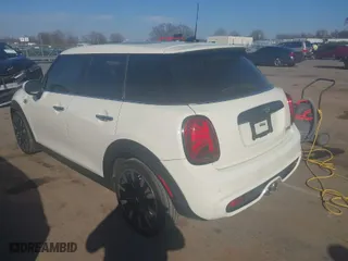 2021 MINI Hardtop 4 Door Cooper S with VIN WMWXU9C00M2P04693, listed as a IAAI auction lot 41785185 with 57,848 mi miles. Bid and sale history available at carsss.com. Image 3.