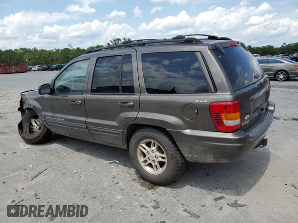 1999 Jeep Grand Cherokee Limited with VIN 1J4GW68S6XC713297, listed as a Copart auction lot 55264384 with 98,912 mi miles and Salvage Title. Bid and sale history available at carsss.com. Image 2.