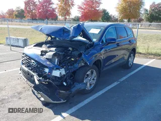2023 Hyundai Santa Fe SE z VIN 5NMS1DAJ0PH552080, wystawiony jako IAAI lot #40653004 z przebiegiem 5 982 mil mil oraz . Historia ofert i sprzedaży dostępna na DreamBid. Obrazek 2.