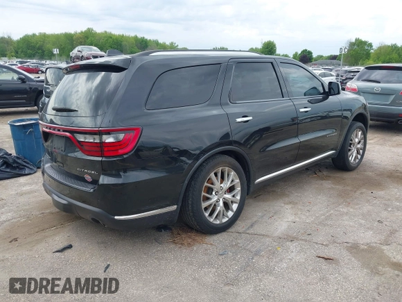 2014 Dodge Durango Citadel with VIN 1C4RDJEGXEC524883, listed as a IAAI auction lot 42357919 with 205,100 mi miles and . Bid and sale history available at DreamBid. Image 4.
