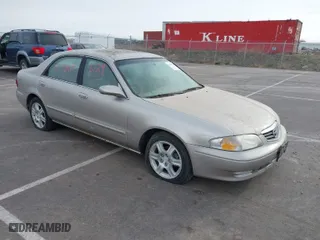 2002 Mazda 626 LX with VIN 1YVGF22DX25263864, listed as a IAAI auction lot 41846129 with 282,516 mi miles. Bid and sale history available at carsss.com. Image 1.