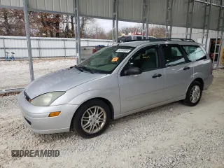 2004 Ford Focus ZTW with VIN 1FAFP35ZX4W145022, listed as a Copart auction lot 82250004 with 185,927 mi miles and Salvage title. Bid and sale history available at DreamBid. Image 1.