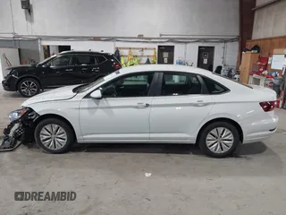 2019 Volkswagen Jetta S z VIN 3VWC57BU6KM129512, wystawiony jako IAAI lot #42205228 z przebiegiem 92 940 mil mil oraz . Historia ofert i sprzedaży dostępna na DreamBid. Obrazek 13.
