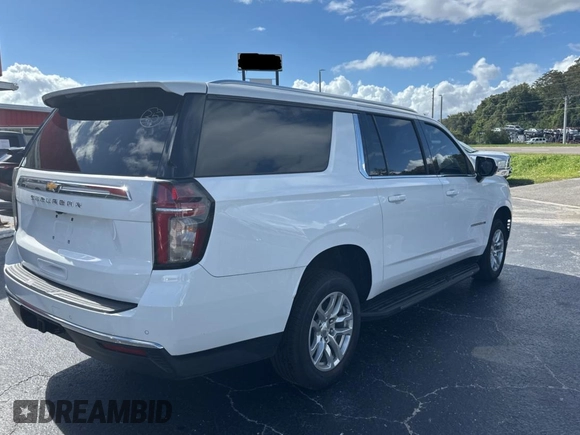 2021 Chevrolet Suburban LS with VIN 1GNSCBKD7MR301059, listed as a Copart auction lot 77436554 with 54,279 mi miles and Clean Title. Bid and sale history available at DreamBid. Image 4.