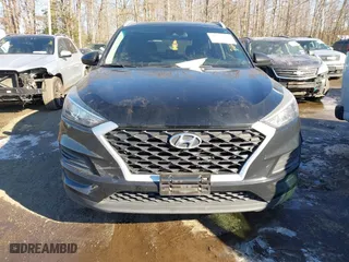 2019 Hyundai Tucson Value with VIN KM8J33A4XKU979791, listed as a IAAI auction lot 41255630 with 90,807 mi miles. Bid and sale history available at carsss.com. Image 12.