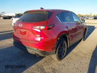 2022 Mazda CX-5 2.5 Turbo with VIN JM3KFBAY4N0564000, listed as a IAAI auction lot 41076013 with 25,106 mi miles and . Bid and sale history available at carsss.com. Image 4.