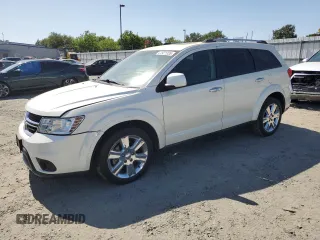 2013 Dodge Journey Crew with VIN 3C4PDCDG5DT668803, listed as a Copart auction lot 61931035 with 121,173 mi miles and Salvage title. Bid and sale history available at DreamBid. Image 1.