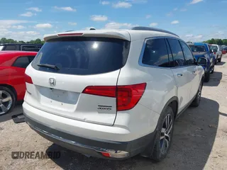 2017 Honda Pilot Touring with VIN 5FNYF6H92HB054145, listed as a IAAI auction lot 42200391 with 70,096 mi miles and . Bid and sale history available at DreamBid. Image 4.