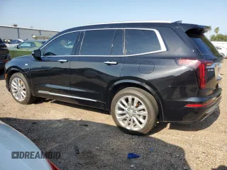 2020 Cadillac XT6 FWD Premium Luxury с VIN 1GYKPCRSXLZ174002, выставлен на аукционе Copart как лот 52083235 с пробегом 79 712 миль миль и Списание • Salvage title. История ставок и продаж доступна на DreamBid. Изображение 2.
