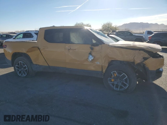2022 Rivian R1T Launch Edition z VIN 7FCTGAAL2NN011755, wystawiony jako Copart lot #81940684 z przebiegiem Nie podano mil oraz Szkoda całkowita • Salvage title. Historia ofert i sprzedaży dostępna na DreamBid. Obrazek 4.