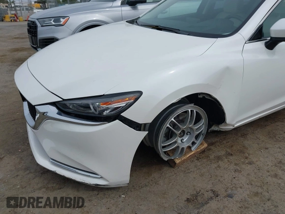 2018 Mazda 6 Grand Touring Reserve with VIN JM1GL1WYXJ1300116, listed as a IAAI auction lot 42088015 with 57,760 mi miles and . Bid and sale history available at DreamBid. Image 6.