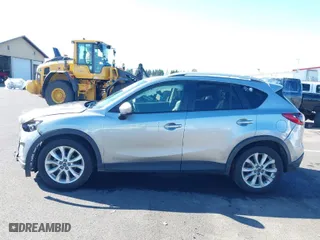 2014 Mazda CX-5 Grand Touring with VIN JM3KE2DY9E0323497, listed as a IAAI auction lot 41678360 with 216,795 mi miles. Bid and sale history available at carsss.com. Image 14.
