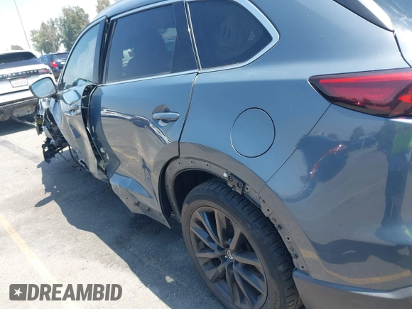 2022 Mazda CX-9 Grand Touring with VIN JM3TCBDY1N0611766, listed as a IAAI auction lot 42452059 with 60,755 mi miles and . Bid and sale history available at DreamBid. Image 17.