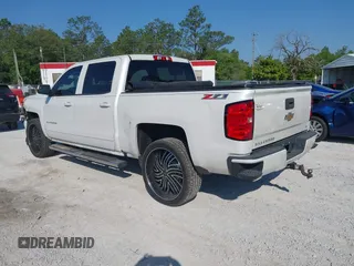 2017 Chevrolet Silverado 1500 LT with VIN 3GCUKREC4HG364108, listed as a IAAI auction lot 42050014 with 148,691 mi miles and . Bid and sale history available at DreamBid. Image 3.