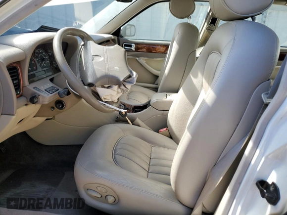 1996 Jaguar XJ with VIN SAJHX1747TC767829, listed as a Copart auction lot 76677444 with Not provided miles and Salvage title. Bid and sale history available at DreamBid. Image 7.