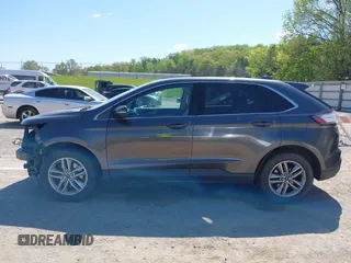 2016 Ford Edge SEL z VIN 2FMPK4J96GBB18054, wystawiony jako IAAI lot #42031225 z przebiegiem 167 461 mil mil oraz . Historia ofert i sprzedaży dostępna na DreamBid. Obrazek 14.