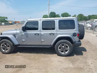 2019 Jeep Wrangler Unlimited Sahara with VIN 1C4HJXEN5KW542403, listed as a IAAI auction lot 42524989 with 60,451 mi miles and . Bid and sale history available at DreamBid. Image 14.