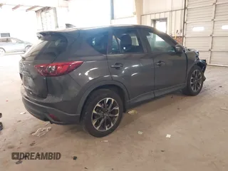 2016 Mazda CX-5 Grand Touring with VIN JM3KE2DYXG0846787, listed as a IAAI auction lot 41346364 with 113,553 mi miles. Bid and sale history available at carsss.com. Image 4.