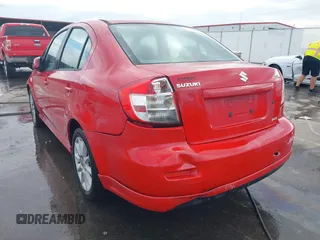 2009 Suzuki SX4 Sport FWD with VIN JS2YC414596200021, listed as a IAAI auction lot 40753192 with 144,805 mi miles and . Bid and sale history available at DreamBid. Image 6.