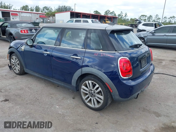 2017 MINI Hardtop 4 Door Cooper with VIN WMWXU1C54H2E19114, listed as a IAAI auction lot 42107266 with 83,524 mi miles and . Bid and sale history available at DreamBid. Image 3.