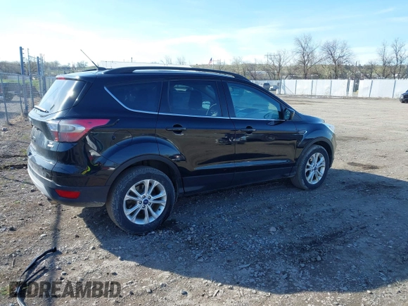 2018 Ford Escape SE z VIN 1FMCU9GD5JUB15259, wystawiony jako IAAI lot #42182040 z przebiegiem 122 194 mil mil oraz . Historia ofert i sprzedaży dostępna na DreamBid. Obrazek 4.