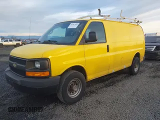 2014 Chevrolet Express Cargo Van with VIN 1GCWGFCA7E1150041, listed as a IAAI auction lot 41387426 with 185,480 mi miles. Bid and sale history available at carsss.com. Image 2.