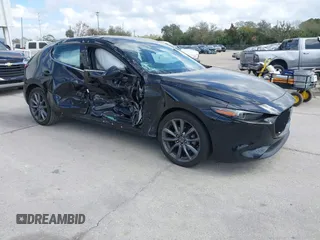 2021 Mazda 3 Premium with VIN JM1BPAML5M1347080, listed as a IAAI auction lot 41557564 with 74,337 mi miles and . Bid and sale history available at DreamBid. Image 1.