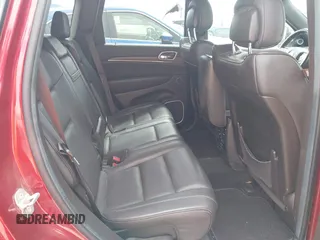 2014 Jeep Grand Cherokee Summit z VIN 1C4RJFJT4EC423217, wystawiony jako IAAI lot #42704059 z przebiegiem 245 928 mil mil oraz . Historia ofert i sprzedaży dostępna na DreamBid. Obrazek 8.
