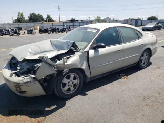 2006 Ford Taurus SE with VIN 1FAFP53U96A169458, listed as a Copart auction lot 59400185 with 103,020 mi miles and Salvage title. Bid and sale history available at DreamBid. Image 1.
