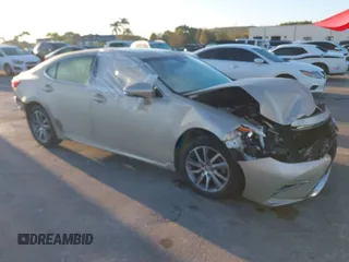 2016 Lexus ES 300h with VIN JTHBW1GG4G2106710, listed as a IAAI auction lot 41684479 with 144,559 mi miles and . Bid and sale history available at DreamBid. Image 1.