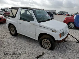 1994 Suzuki Sidekick z VIN 2S3TA01C8R6408593, wystawiony jako Copart lot #65011514 z przebiegiem 248 814 mil mil oraz Tytuł czysty. Historia ofert i sprzedaży dostępna na DreamBid. Obrazek 4.