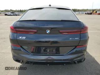 2025 BMW X6 xDrive40i z VIN 5UX33EX05S9Z28763, wystawiony jako Copart lot #54533525 z przebiegiem 1329 mil mil oraz Szkody całkowita. Historia ofert i sprzedaży dostępna na DreamBid. Obrazek 6.