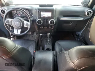 2014 Jeep Wrangler Unlimited Rubicon with VIN 1C4HJWFG9EL199501, listed as a Copart auction lot 61443595 with 86,940 mi miles and Salvage title. Bid and sale history available at DreamBid. Image 8.