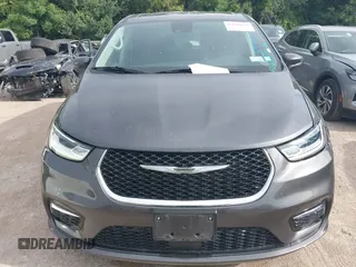 2023 Chrysler Pacifica Touring L with VIN 2C4RC1BG8PR594481, listed as a IAAI auction lot 42618839 with 60,748 mi miles and . Bid and sale history available at DreamBid. Image 6.