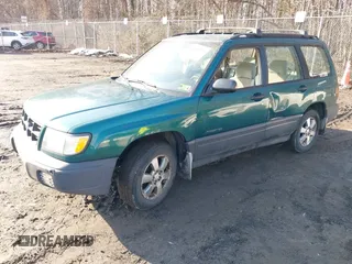 1999 Subaru Forester L with VIN JF1SF635XXH735202, listed as a IAAI auction lot 41489355 with 290,000 mi miles. Bid and sale history available at carsss.com. Image 2.